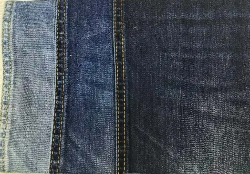 Performance Coolmax denim fabric with technical moisture-wicking weave for activewear and functional outdoor jeans.