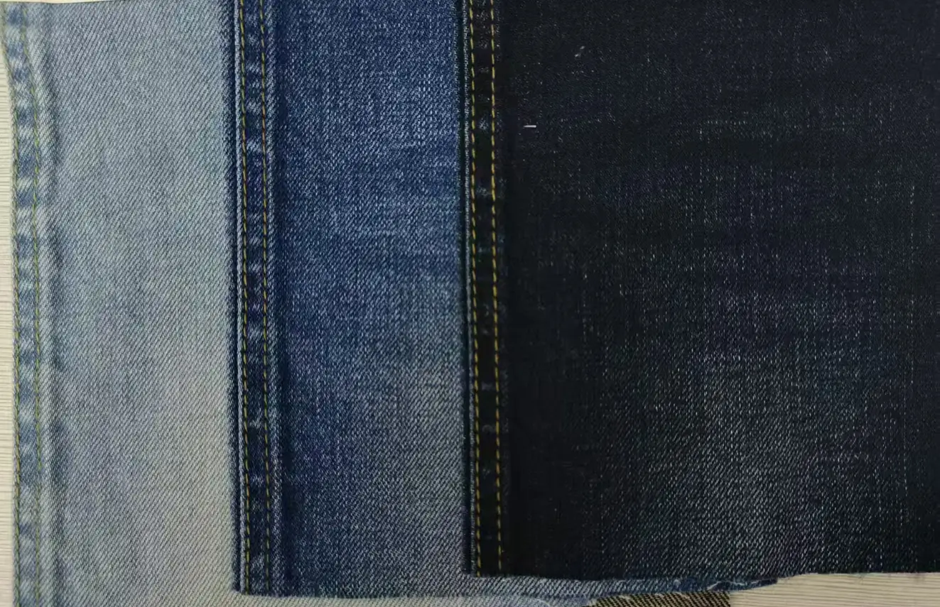 Breathable linen blend denim fabric displaying natural flax fiber textures for summer-weight jackets and trousers.