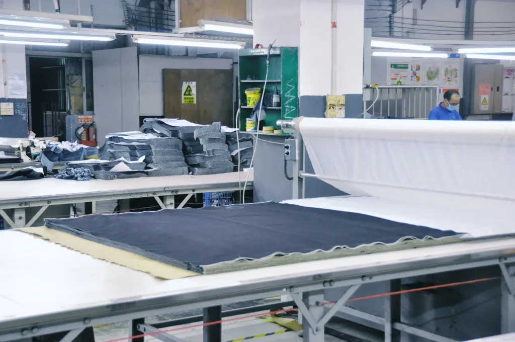 reego denim fabric cutting table factory floor