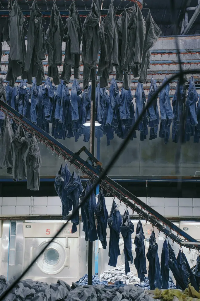 raw denim vs washed denim - washed denim garments after industrial laundry process